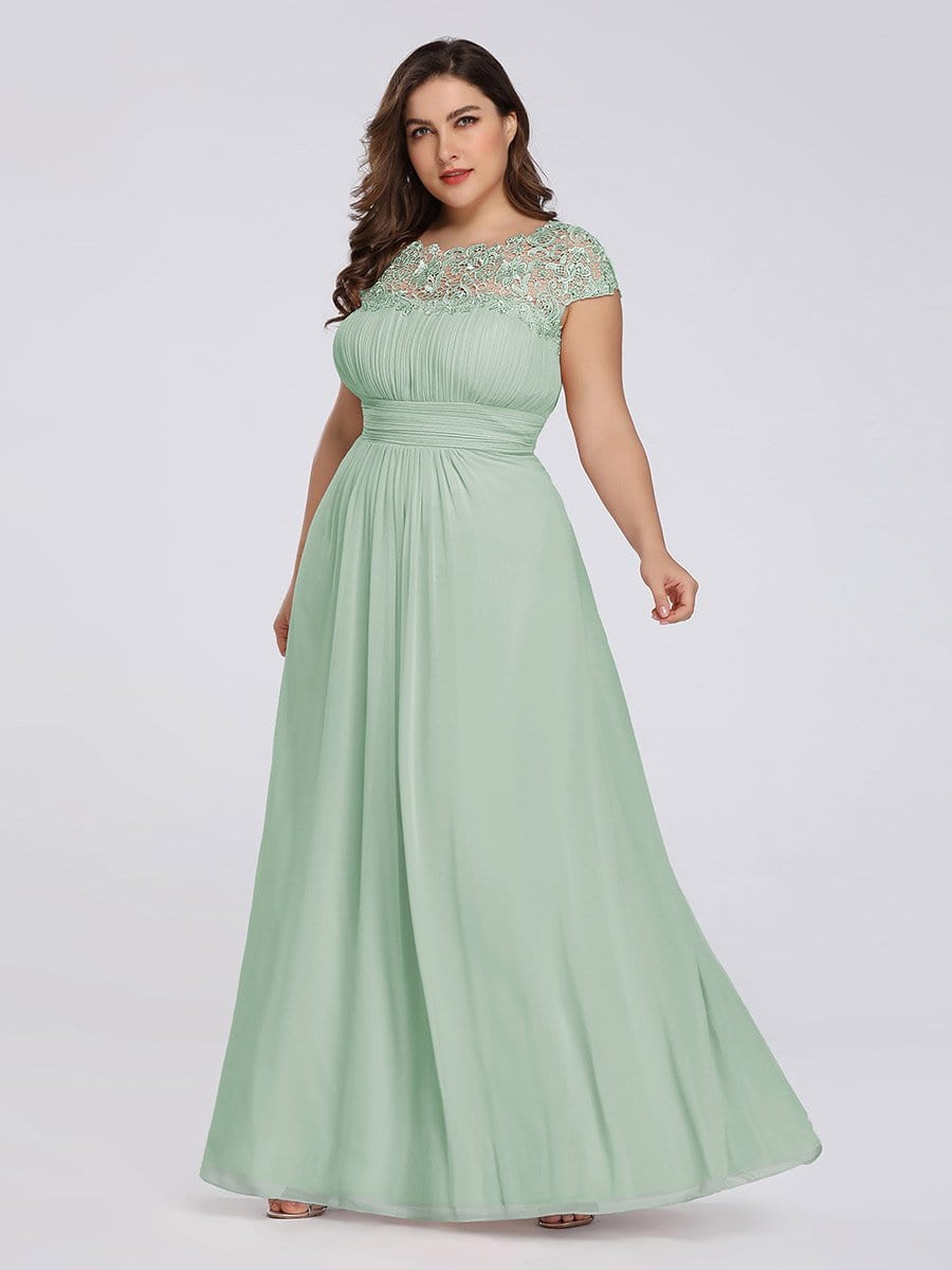 Elegant Lace Cap Sleeve Chiffon Evening Gown with Ruched Detail: Lacey Neckline Open Back Ruched Bust Plus Size Evening Dress